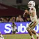 Photo of Fresno State quarterback Jorge Rena eyeing a receiver downfield against USC