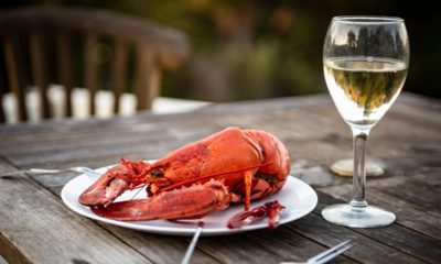 Photo of lobster and wine on a table