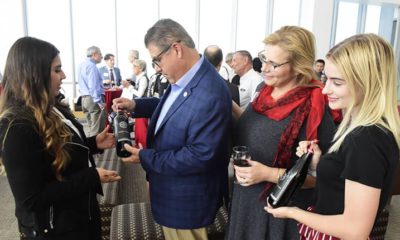 Photo of wine presentation to Fresno State President Joseph Castrohe un