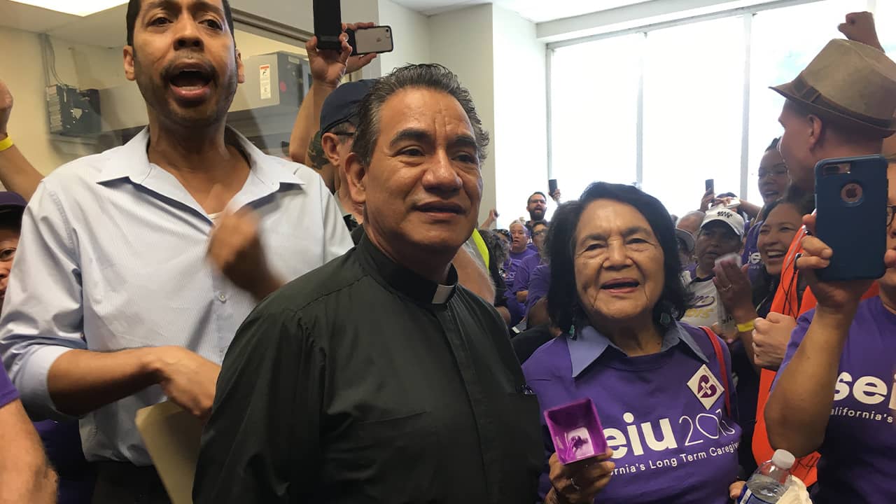 Photo Derek Smith and Dolores Huerta protesting