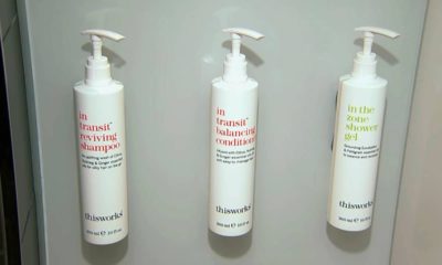Photo of little shampoo, conditioner and shower gel bottles