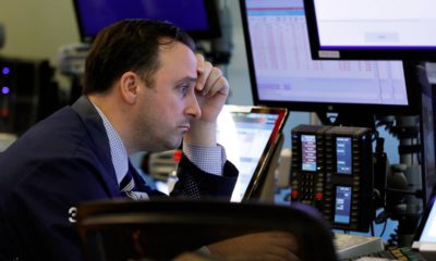 Photo of trader Brandon Barb working on the floor of the stock market