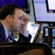 Photo of trader Brandon Barb working on the floor of the stock market