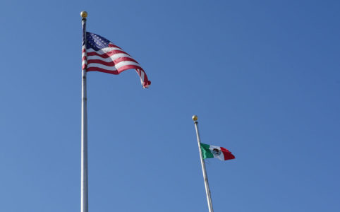 The American and Mexican flag fly at Fresno City Hall (GV Wire/Jahz Tello)