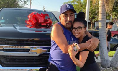 Photo of Yesenia Valencia and her dad after she surprised him with a new truck