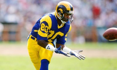 Photo of Henry Ellard preparing to catch a football in a Los Angeles Rams uniform