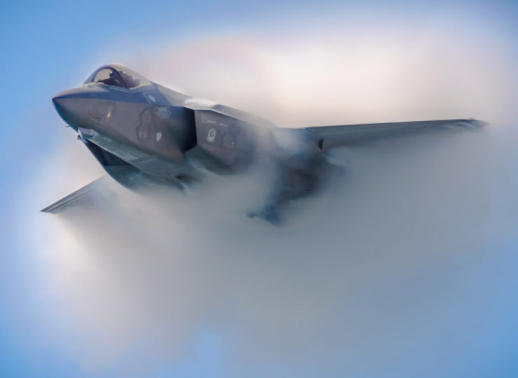 F35 Viper Stealth Fighter creates a vapor cloud in the sky over Huntington Beach during the Great Pacific Airshow.