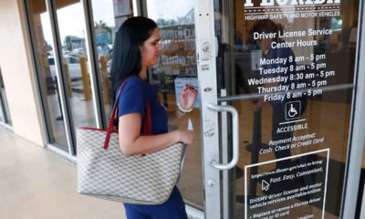 Photo of a woman entering a Florida Highway Safety and Motor Vehicles drivers license service center