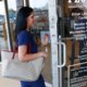 Photo of a woman entering a Florida Highway Safety and Motor Vehicles drivers license service center