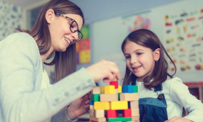 Photo of woman and child with building blocks