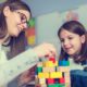 Photo of woman and child with building blocks