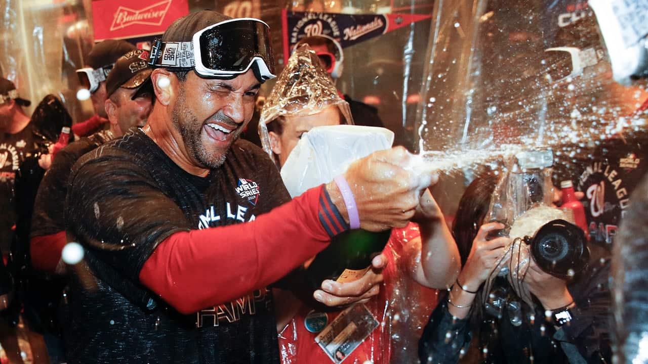 Photo of Washington Nationals manager Dave Martinez celebrating