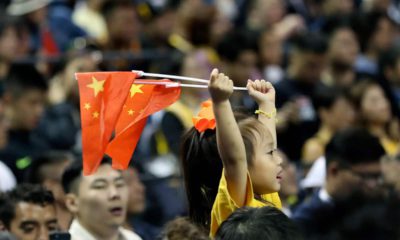 Photo of a child holding Chinese national flags