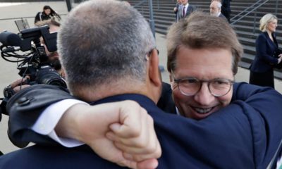 Photo of Attorney Mark Lanier getting a hug
