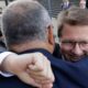 Photo of Attorney Mark Lanier getting a hug