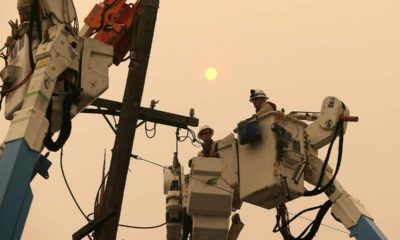 Photo of PG&E workers working to restore power lines in 2018