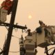 Photo of PG&E workers working to restore power lines in 2018