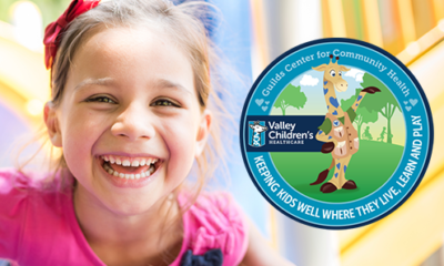 Photo of a smiling girl and logo for Valley Children's new center to promote children's health