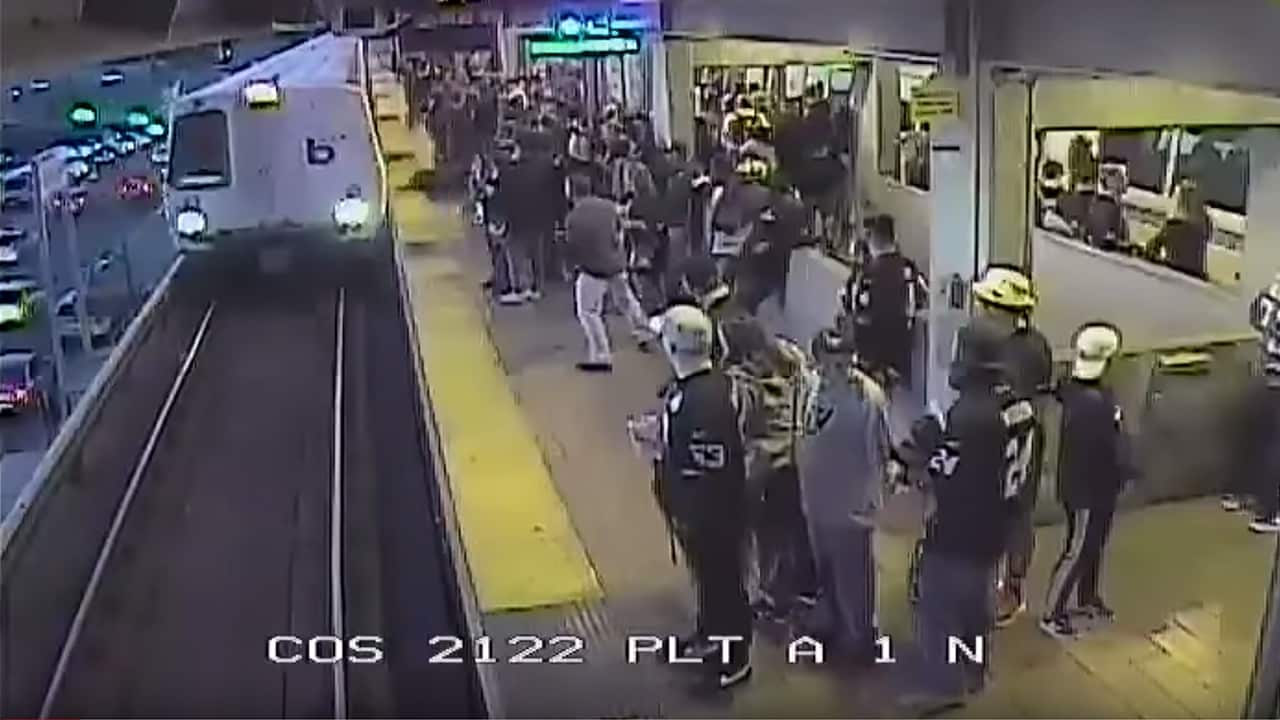Photo of BART employee saving a man from the train