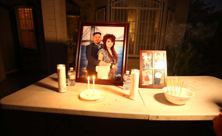In this photo taken Monday, Nov. 18, 2019, a memorial for shooting victim Kou Xiong sits in front of his home where he was shot in Fresno, Calif. A close-knit Hmong community was in shock after gunmen burst into a California backyard gathering and shot 10 men, killing four. "We are right now just trying to figure out what to do, what are the next steps. How do we heal, how do we know what's going on," said Bobby Bliatout, a community leader. (Larry Valenzuela/The Fresno Bee via AP)
