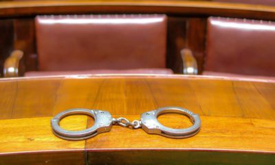 Photo of handcuffs on a court bench