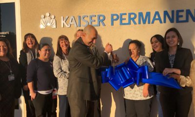Phot of Dr. Shahzad Jahromi cutting the ribbon on a new building