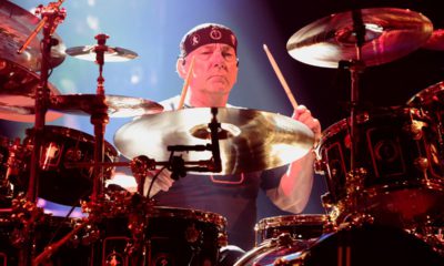 Photo of Neil Peart of the band Rush performing in concert