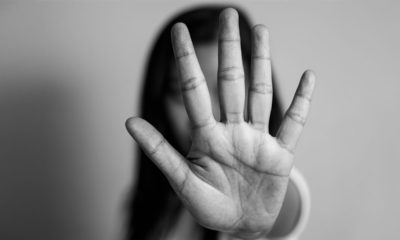 Photo of a girl with her hand to the camera
