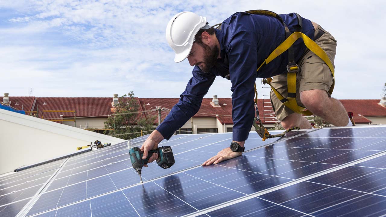Solar panels being installed on a home.