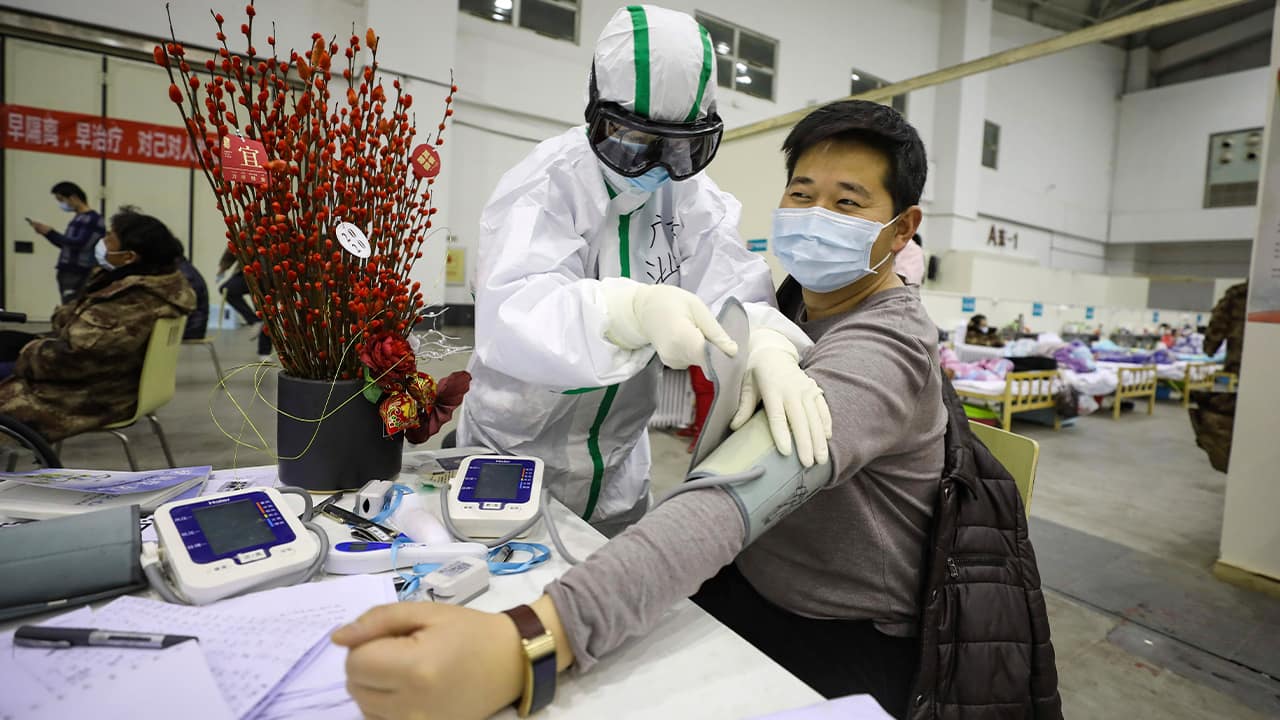 Photo of a medical staff member attends to a patient