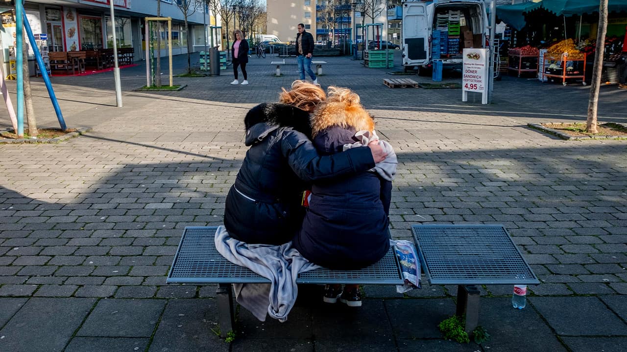 Photo of two women mourning in Germany