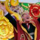 Photo of Actor Bryan Cranston waving beads