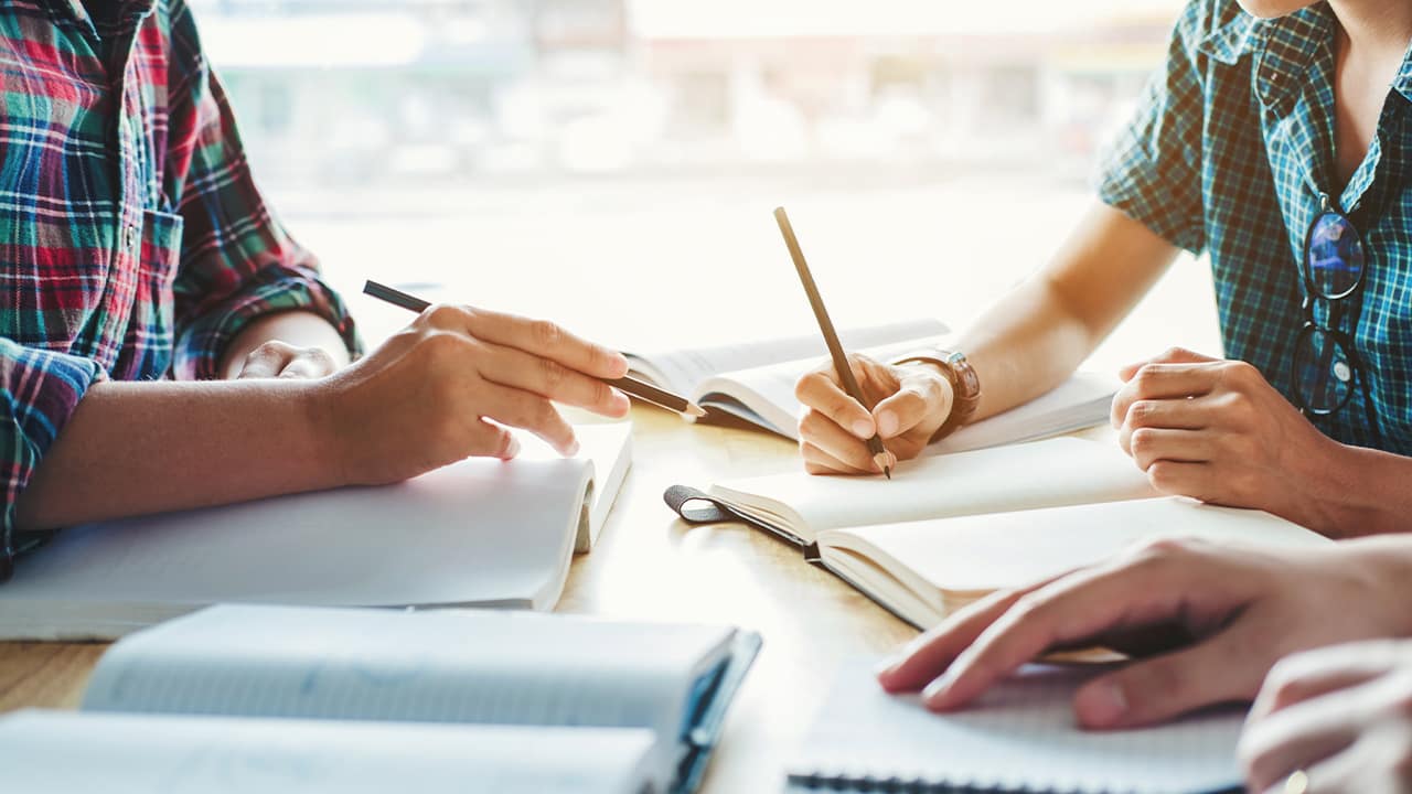 Photo of students taking notes