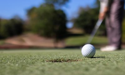 Photo of a man playing golf