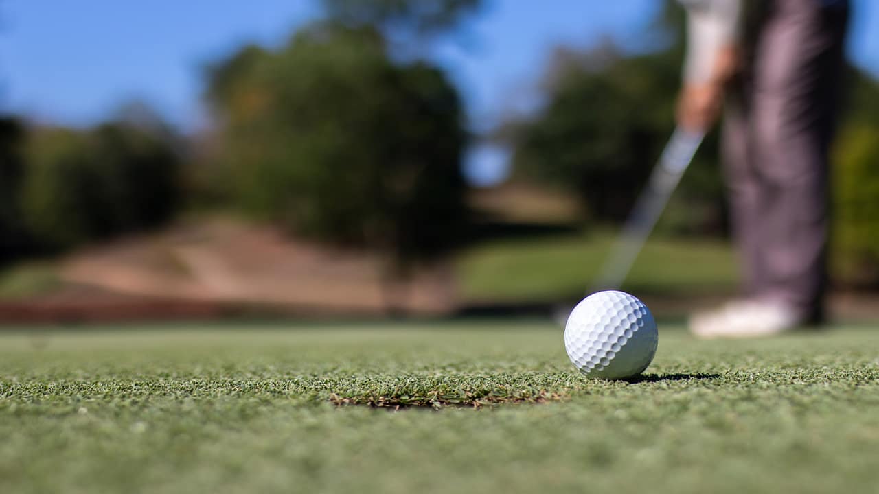 Photo of a man playing golf