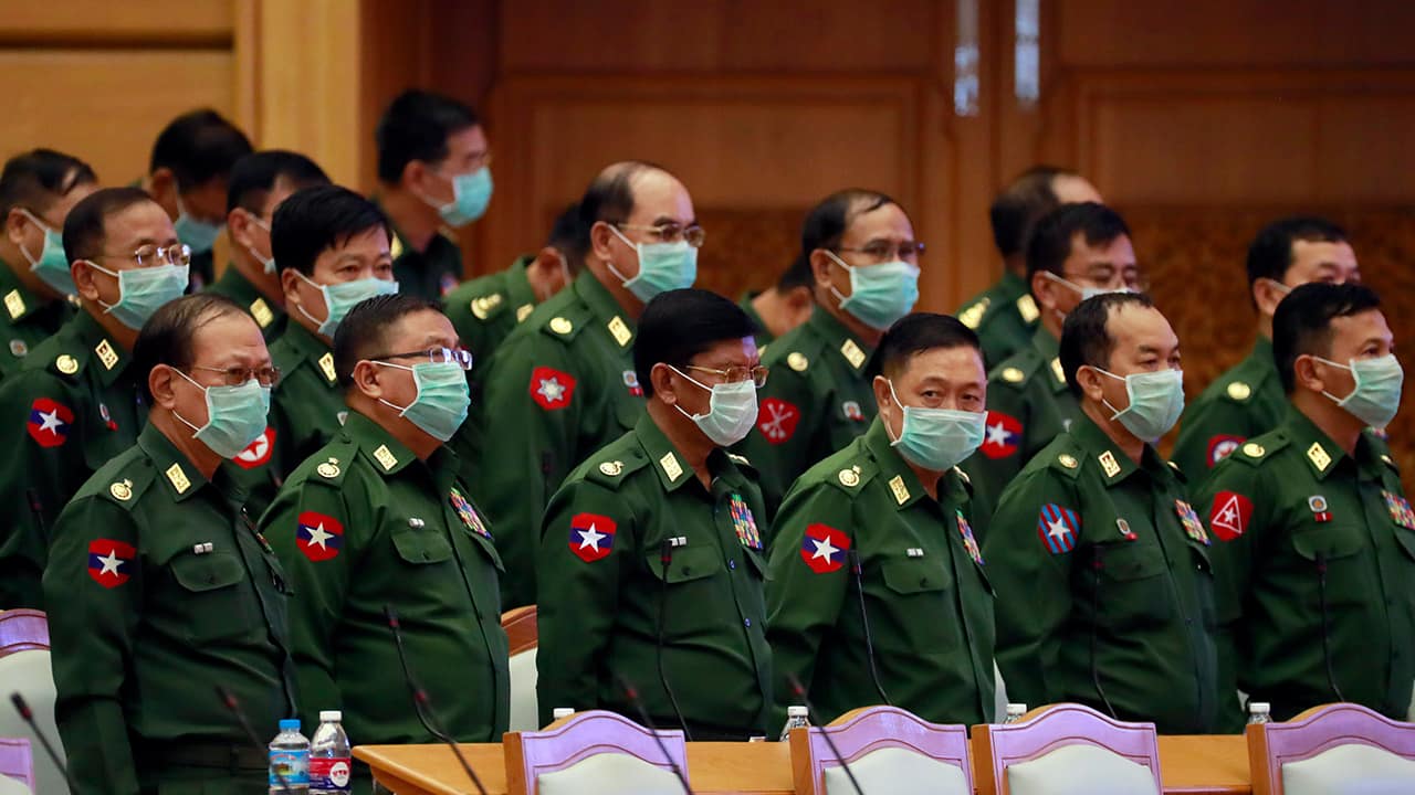 Photo of military representatives wearing masks