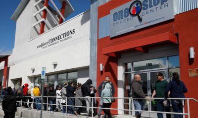 People waiting in line for help with unemployment benefits