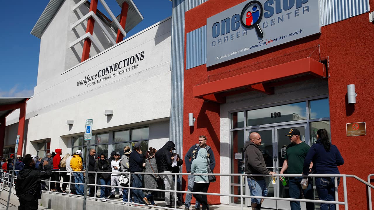 People waiting in line for help with unemployment benefits