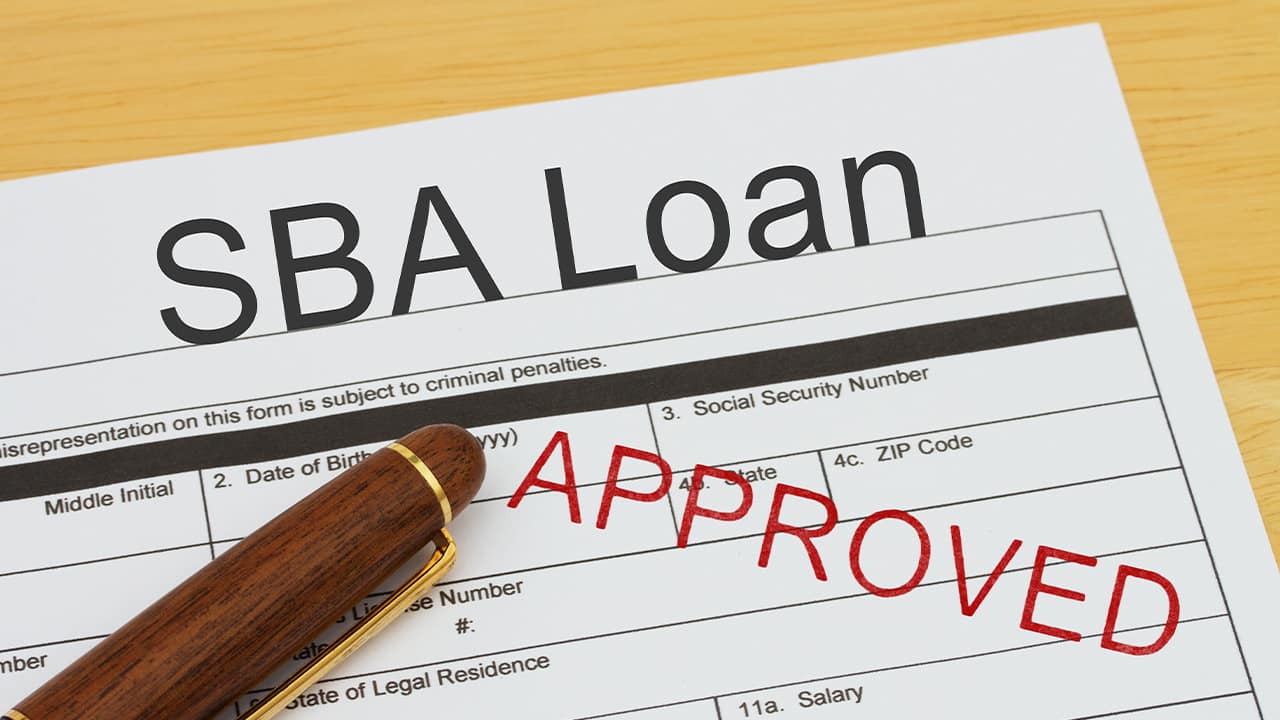 Photo of an SBA application form stamped "approved"