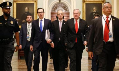Photo of Treasury Secretary Steven Mnuchin, left, accompanied by White House Legislative Affairs Director Eric Ueland and acting White House chief of staff Mark Meadows