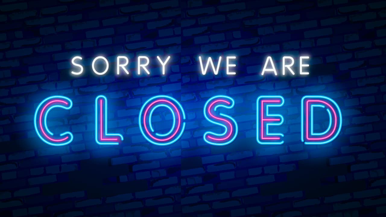 Neon "closed" sign at a bar