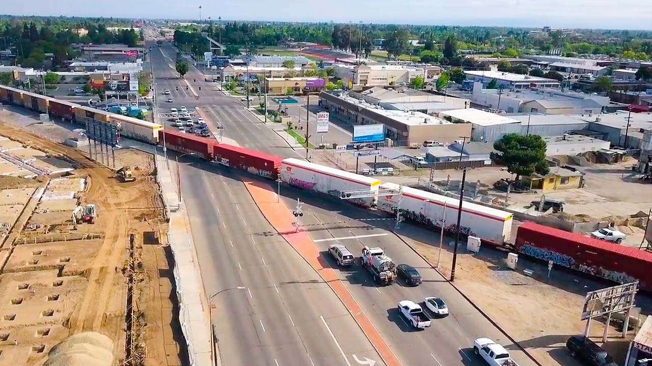 Aerial view of diagonal BNSF train crossing at Blackstone and McKinley avenues in Fresno, California