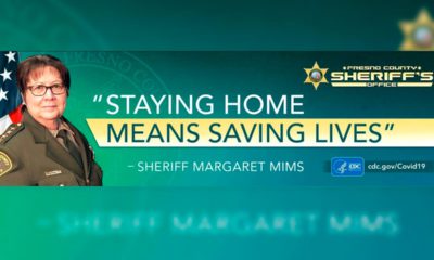 Photo of COVID-19 billboard featuring Fresno County Sheriff Margaret Mims