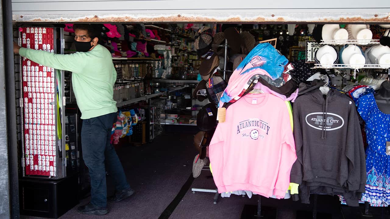 Photo of a man closing the door to his business