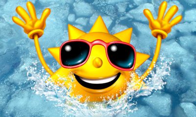 Image of a cartoon sun wearing sunglasses and emerging from an ice bath