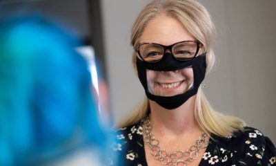 Photo fo a woman wearing a face mask with a window