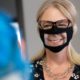 Photo fo a woman wearing a face mask with a window