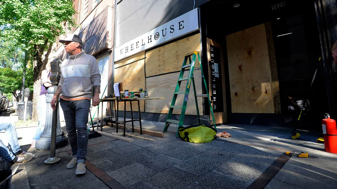 Photo of Johnny Grimes outside of his salon