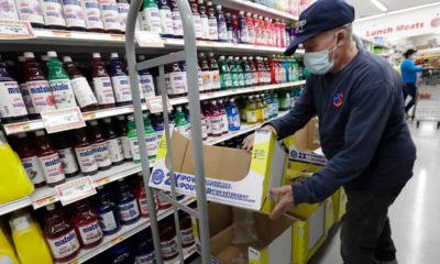 Photo of Juan Santos stocking shelves