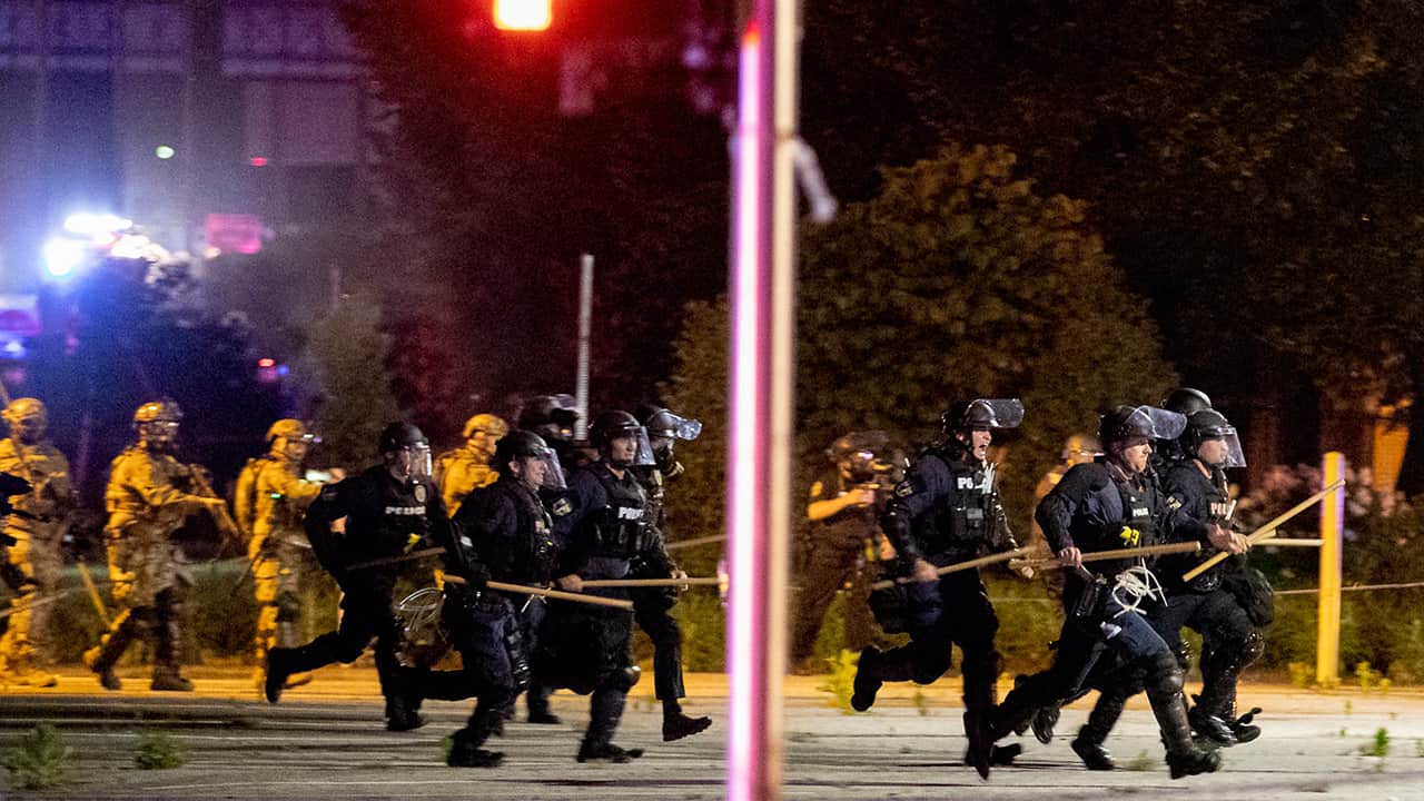 Photo of Louisville police and National Guard troops